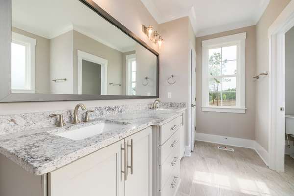 Oversized bathroom mirror with matching bathroom hardware