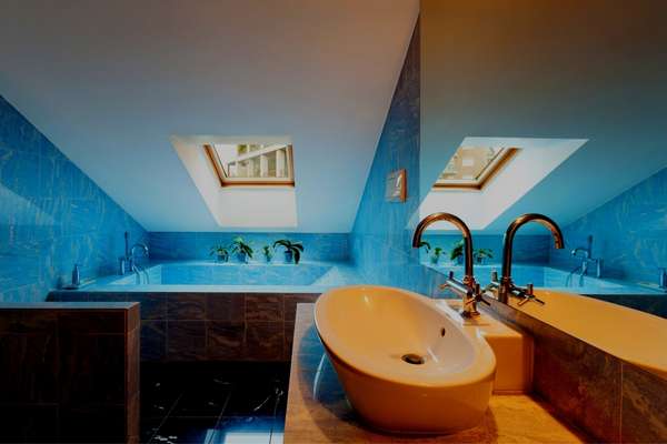 Small bathroom windows with blue walls