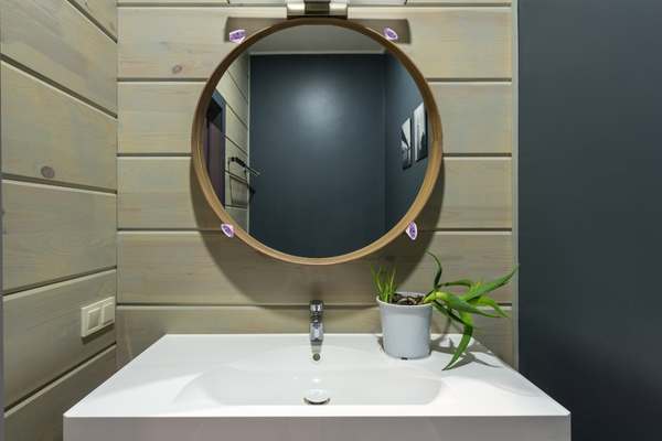 White mirror with diamond pattern in bathroom