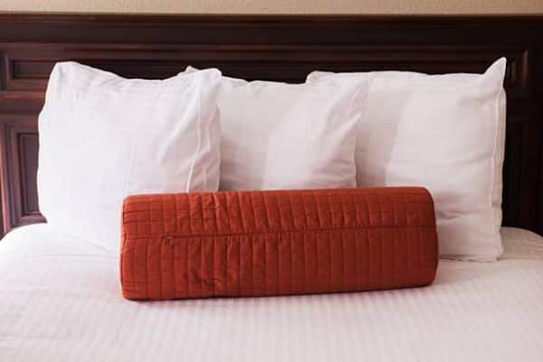Roll towels into simple bumpers To Stop Pillows From Falling Behind Adjustable Bed