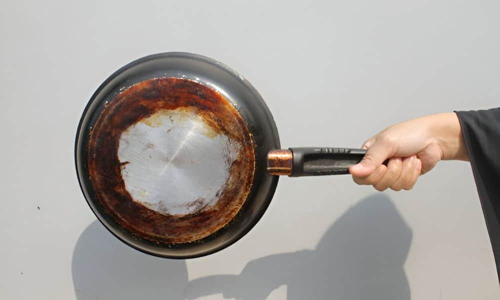 How to clean burnt grease from bottom of frying pans