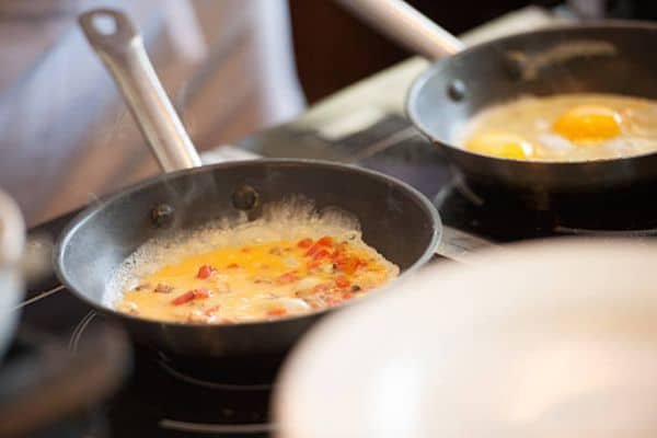 Common Mistakes Beginners Make to scramble eggs in a stainless steel pan