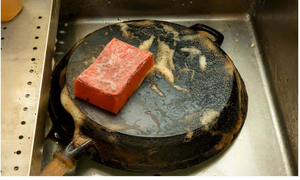 how to clean burnt cast iron pan