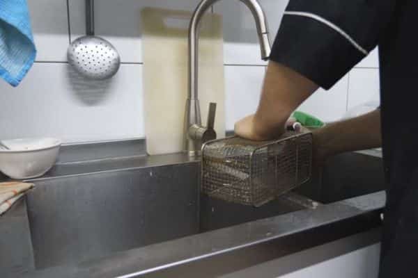 Scrub Safely to clean deep fryer basket